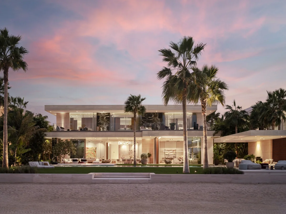 Contemporary EŌME architecture framed by landscaped gardens at dusk